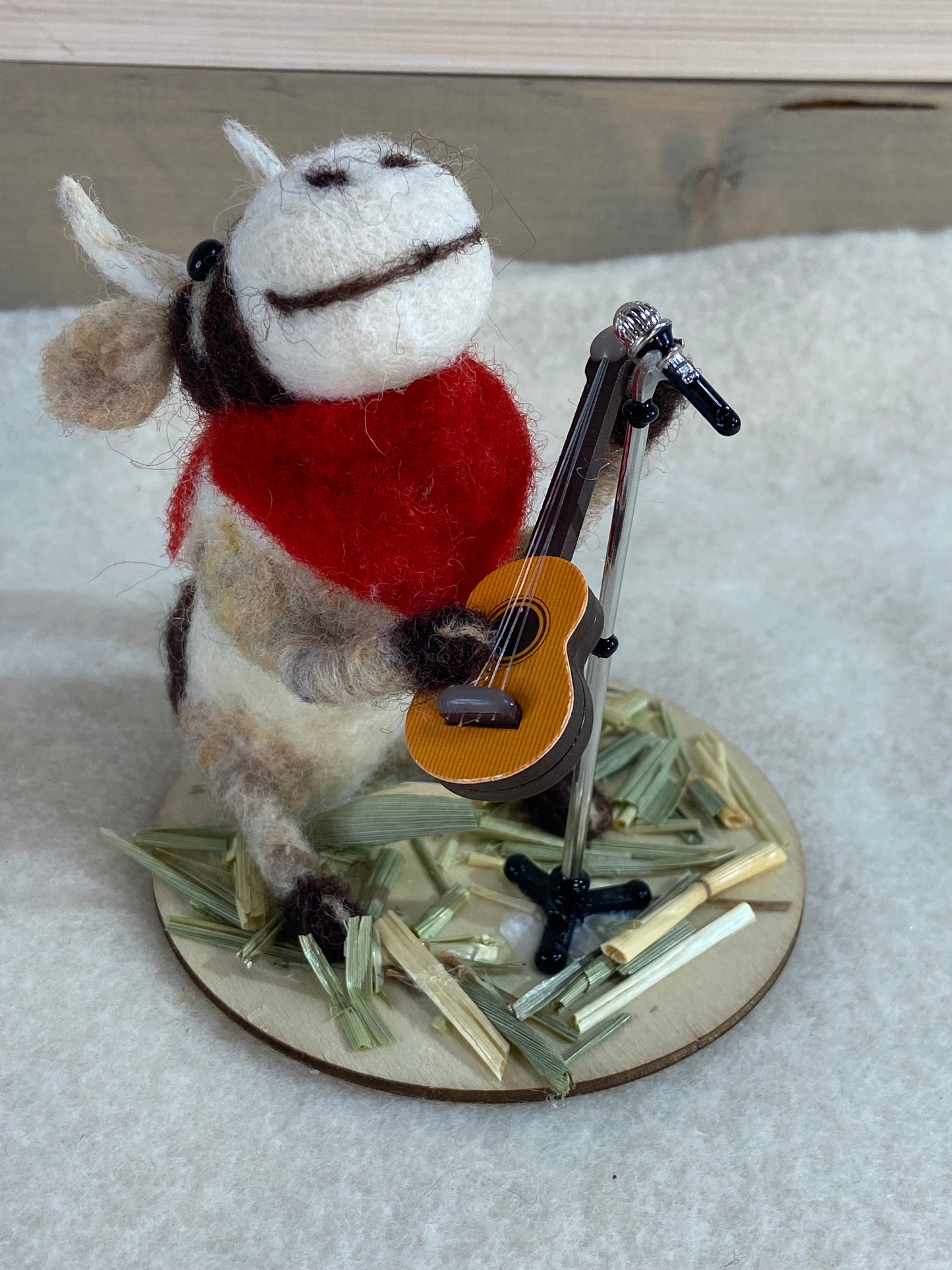 Cow with guitar and mic stand - Moosician